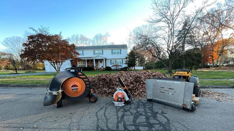 Leaf loader and blowers set up for a fall cleanup